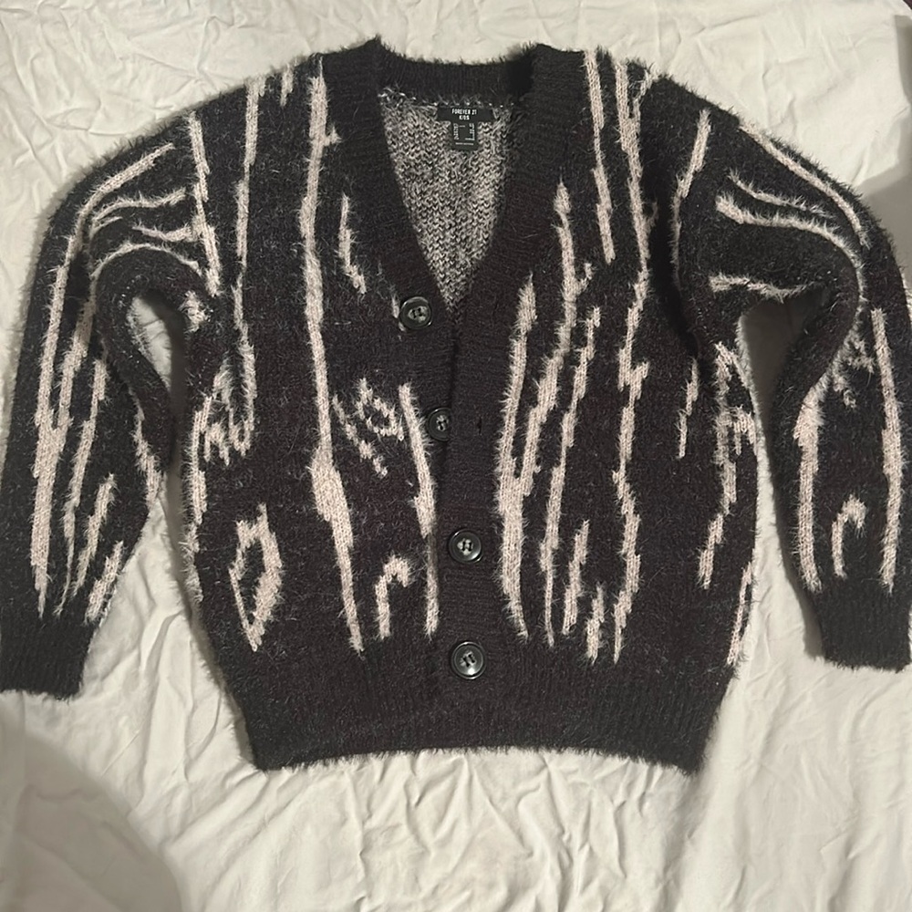 This is a kids cardigan never worn. Unisex.